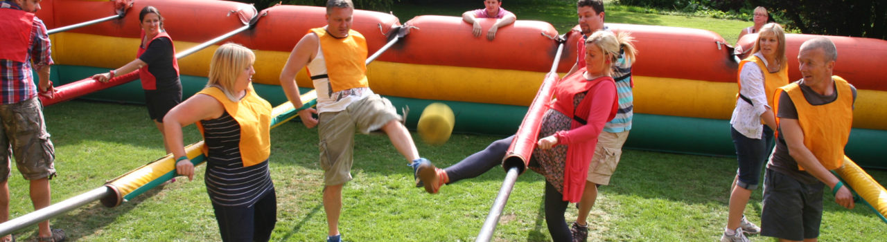 Photo of human table football team building event