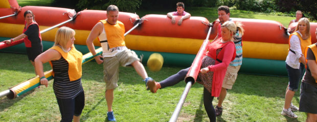 Photo of human table football team building event