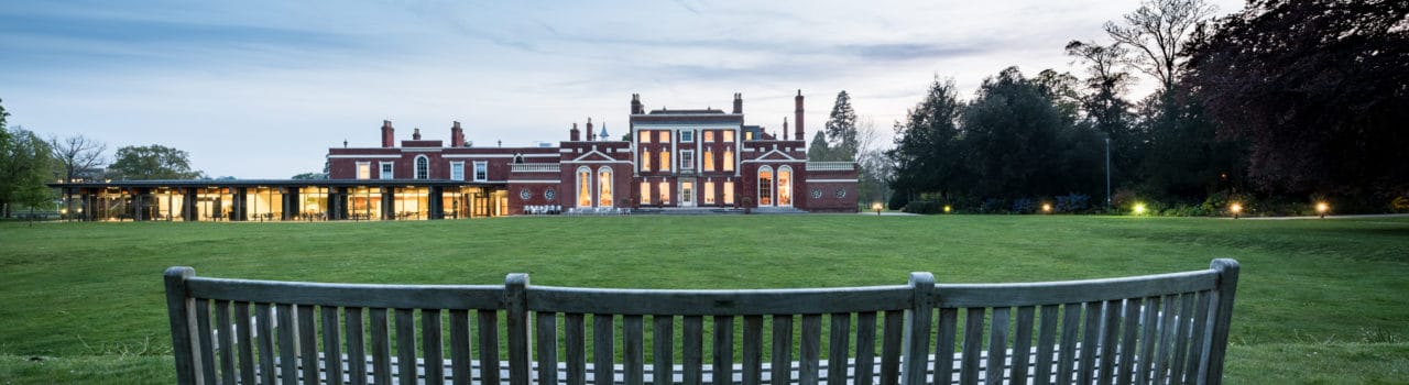 Image of Hinxton Hall and lawns at dusk Image of Hinxton Hall and lawns at dusk