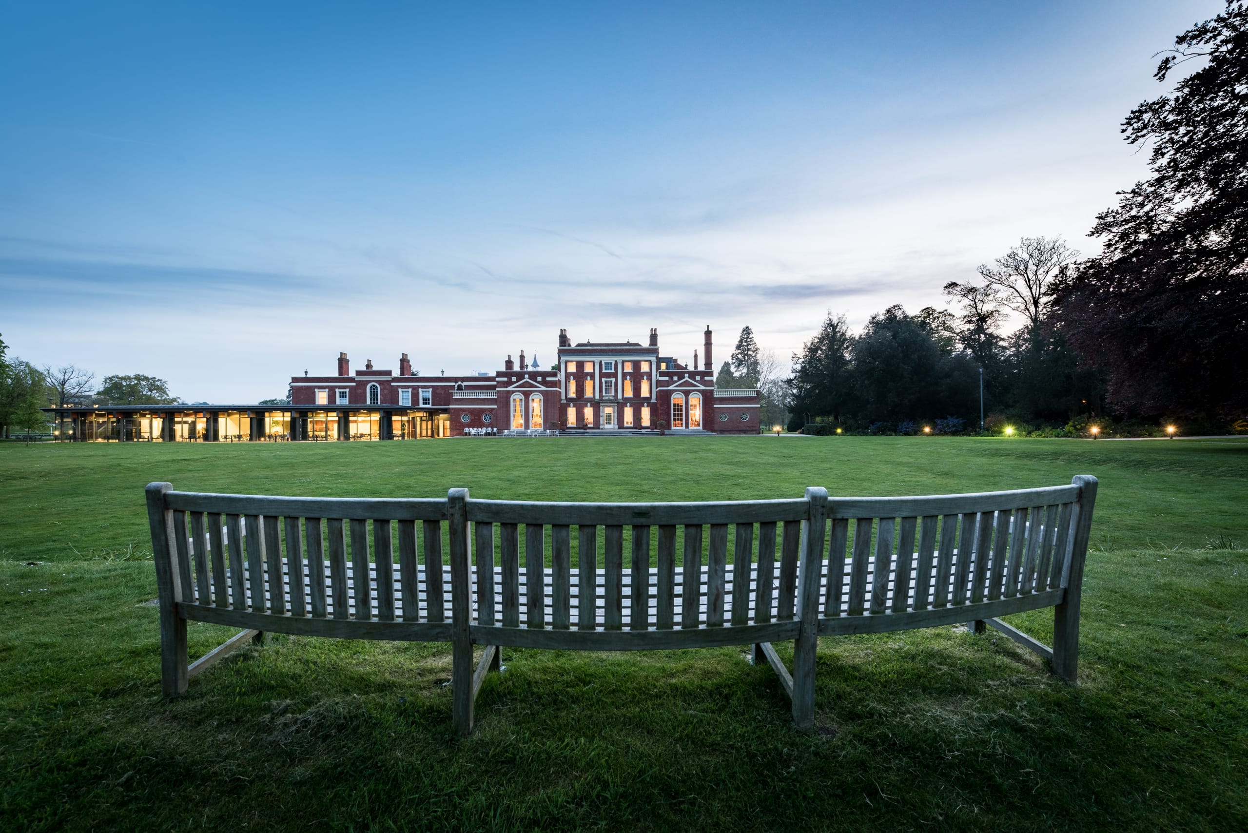 Image of Hinxton Hall and lawns at dusk
