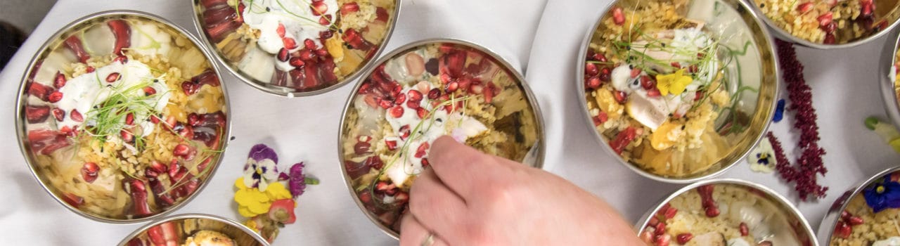 Chef adding final touches to a dish