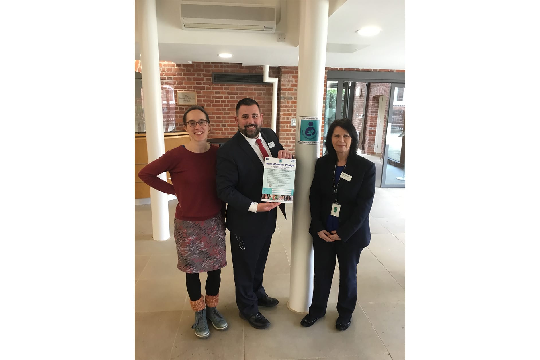 Hinxton Hall Conference Centre staff holding the Breastfeeding Pledge.