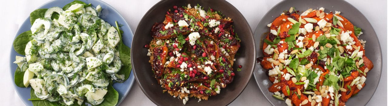 Three plates with colourful foods