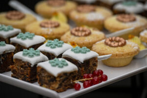 Bite-sized Christmas cake and mince pies topped with sugar decorations
