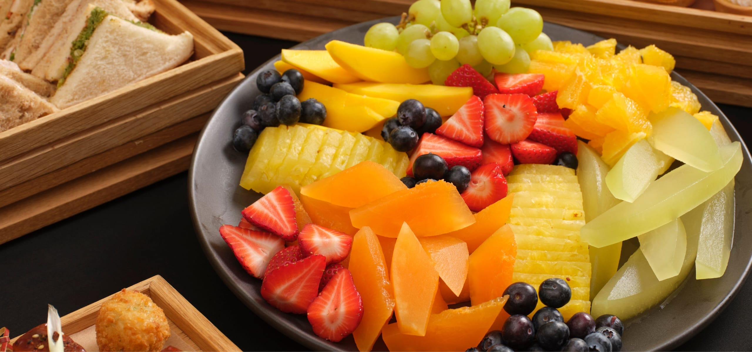 An example of our summer lunch buffet, showing sandwhiches and a fruit platter.