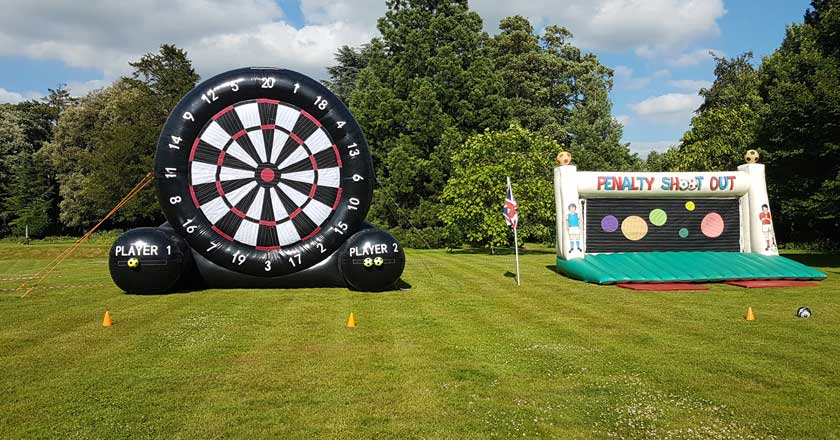 Two inflatable games on our lawn. One is a huge dart board, and one is a penalty shoot out.